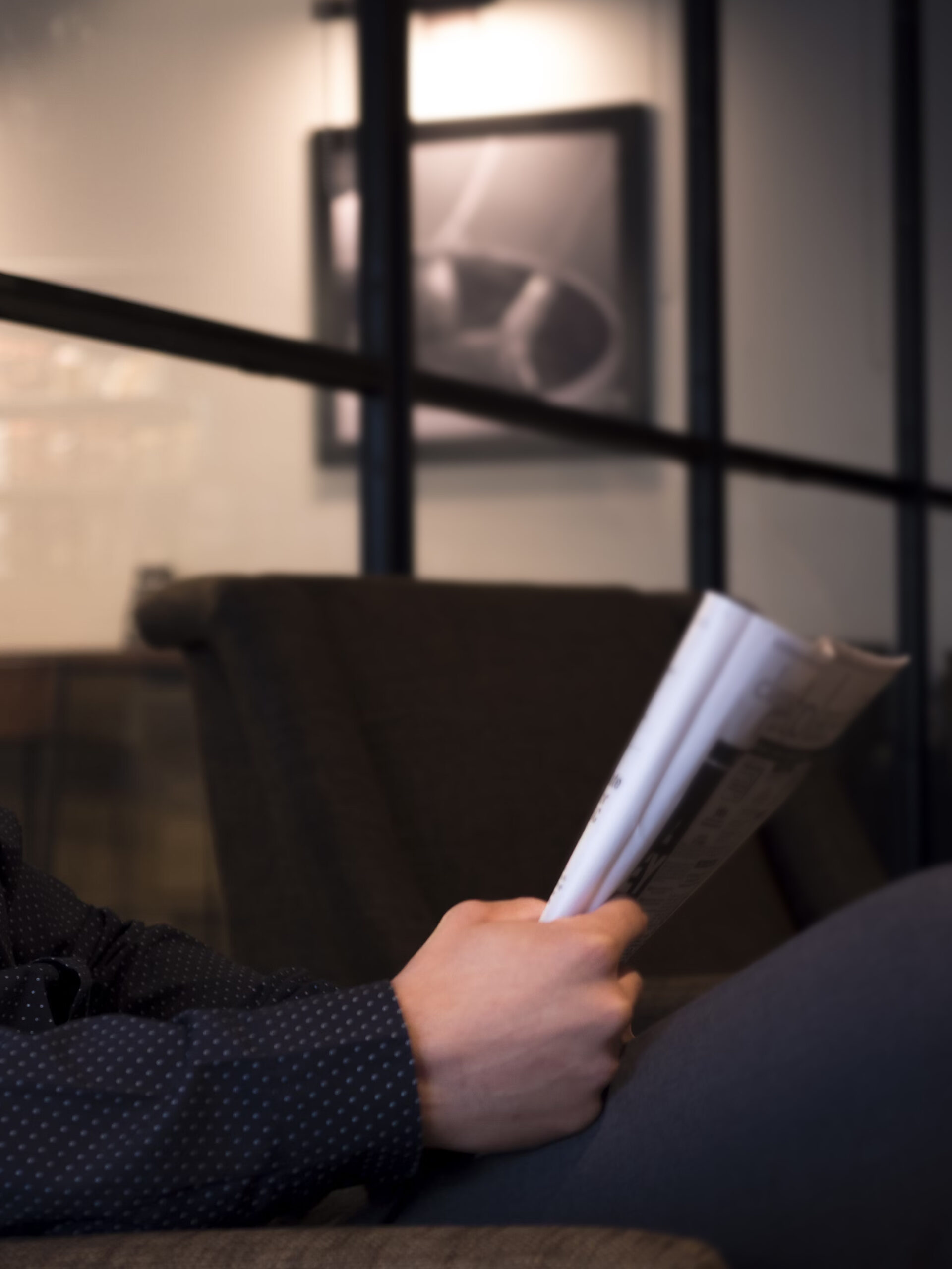 Image of a man reading a magazine