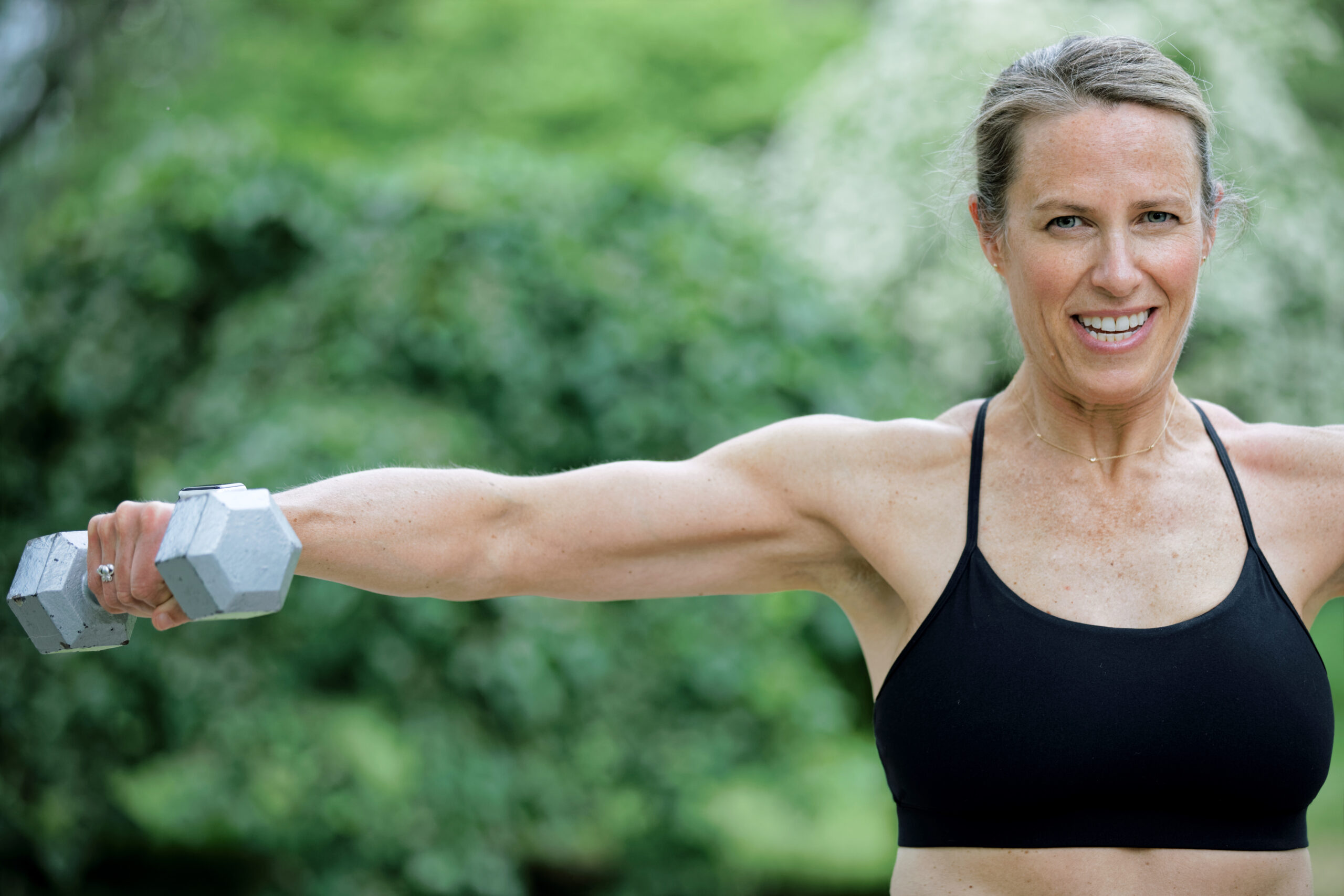 Middle aged woman lifting weights