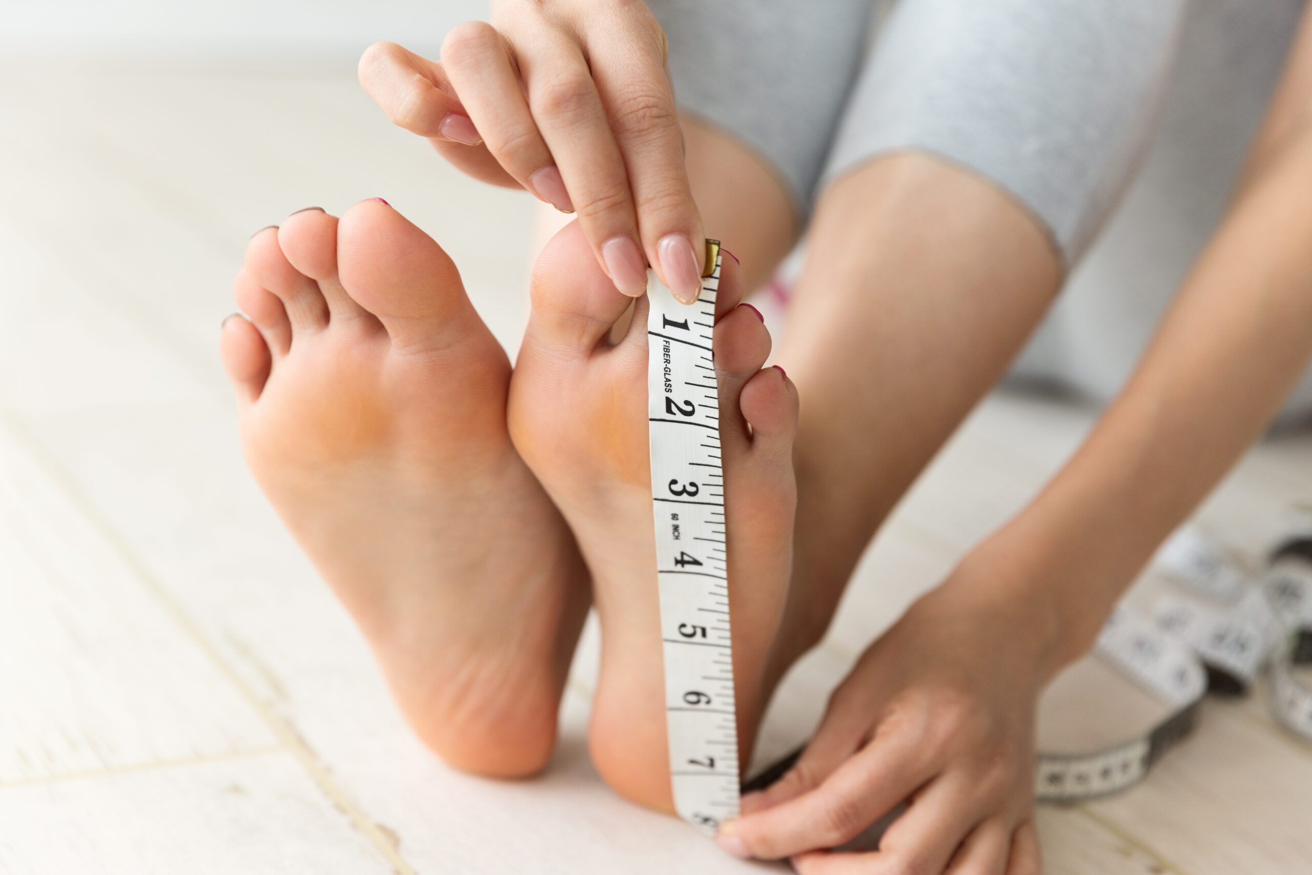 Woman measuring foot