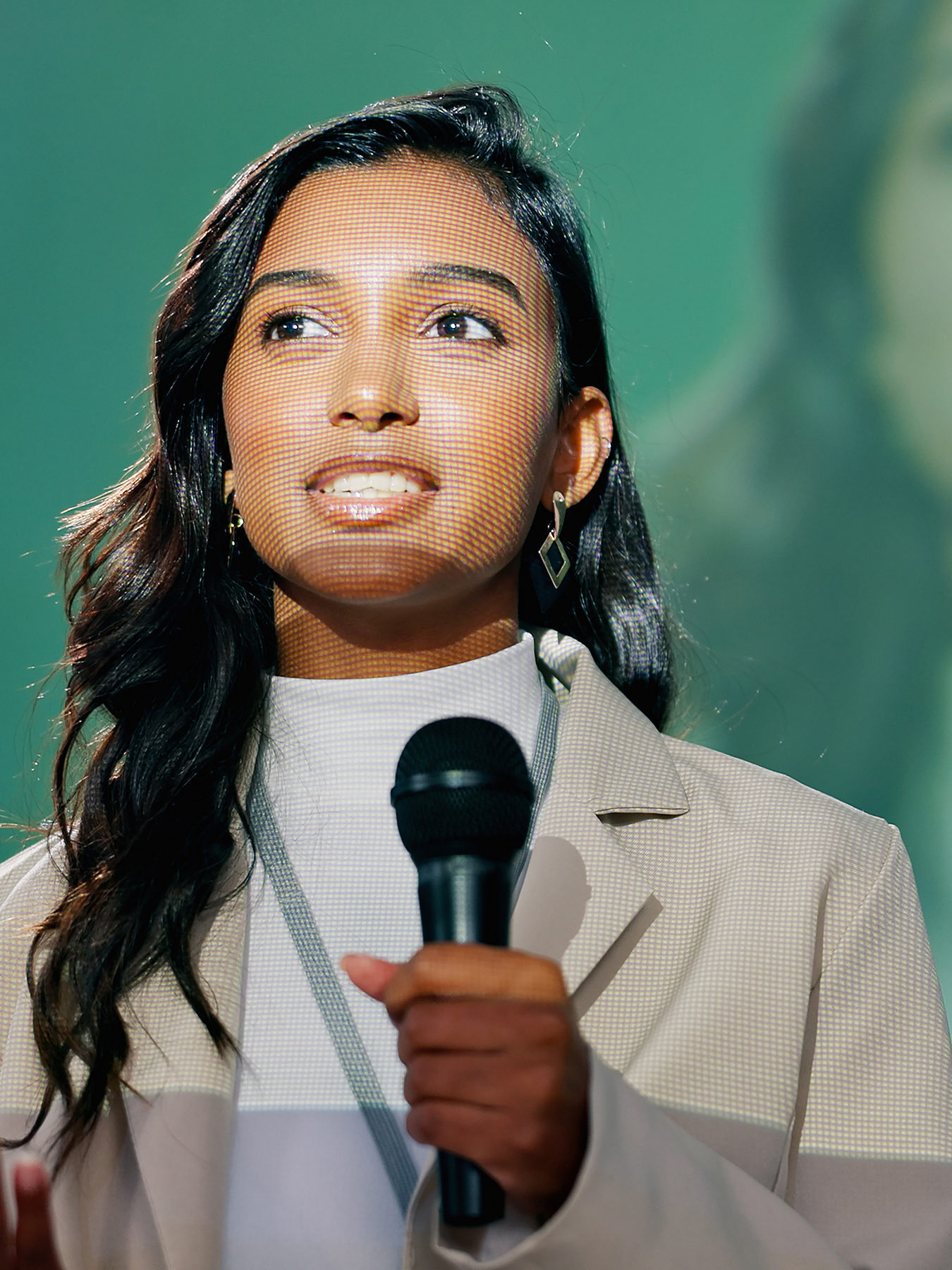 Conference, presentation or seminar and public speaking woman with microphone on stage for development speech. Business, podium and tradeshow with Indian motivational speaker in corporate auditorium