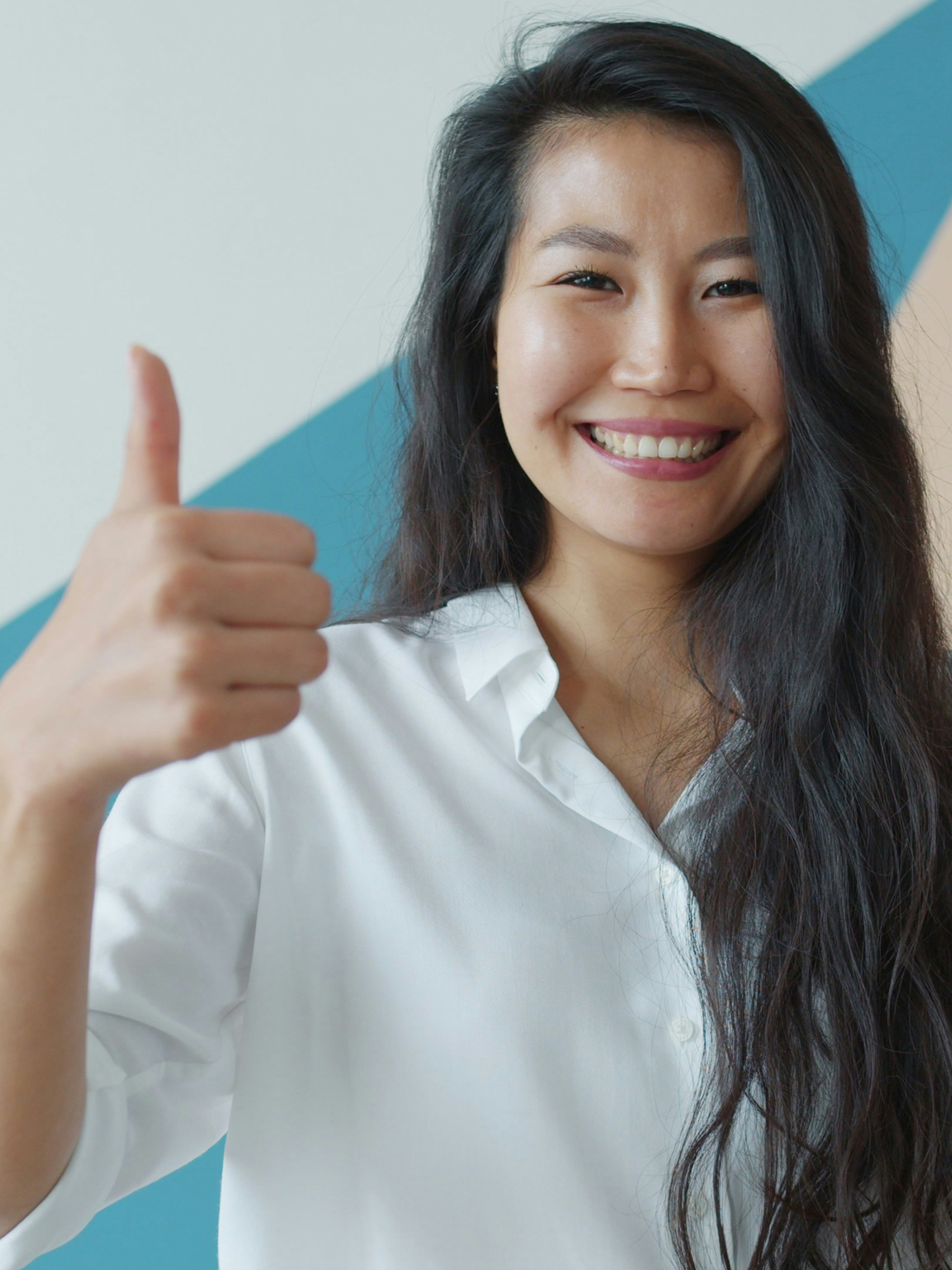 Image of a smiling woman with her thumb up